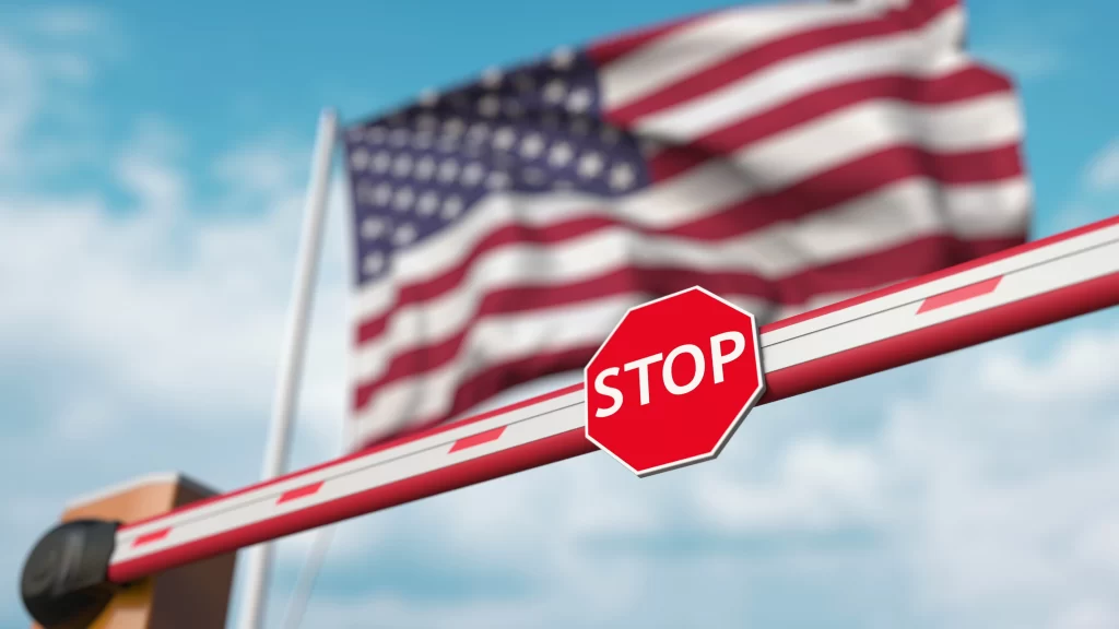 Stop sign in front of USA flag