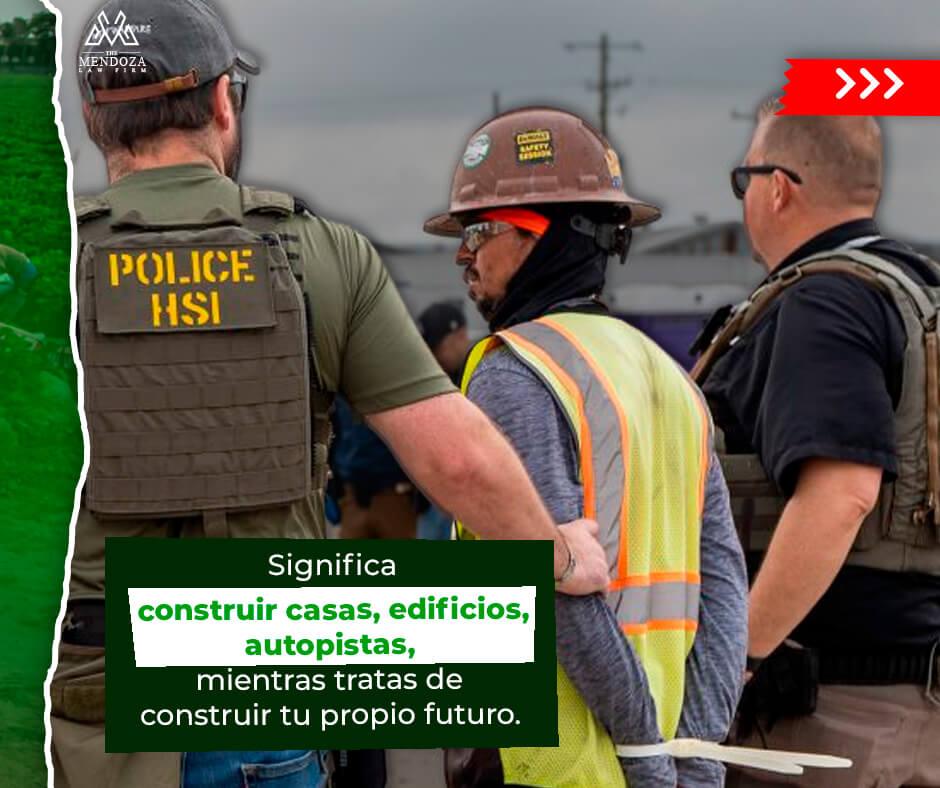 A worker is detained by officers