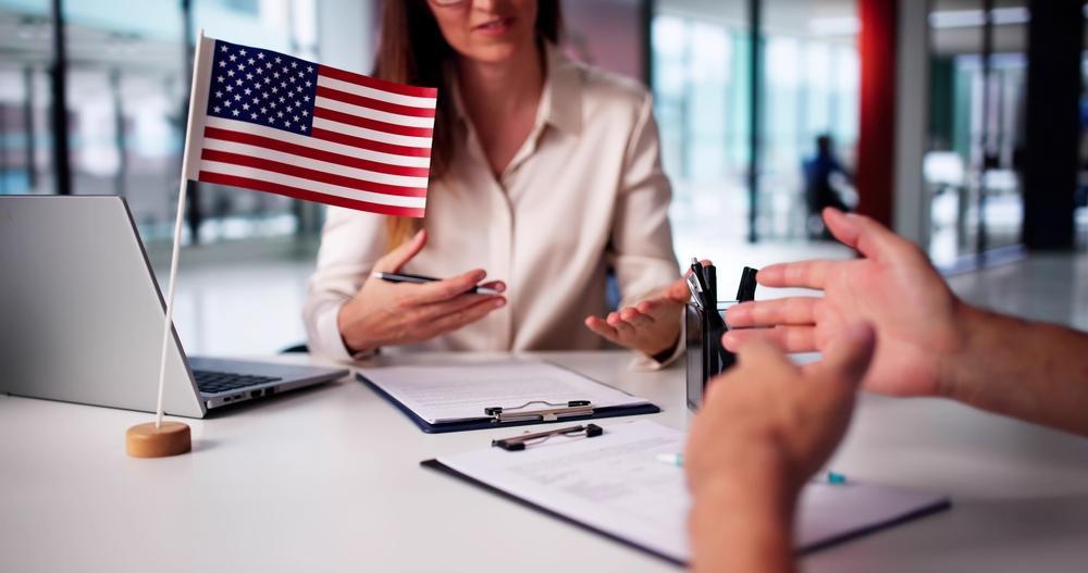 A woman at an immigration office explaining how long a U visa lasts